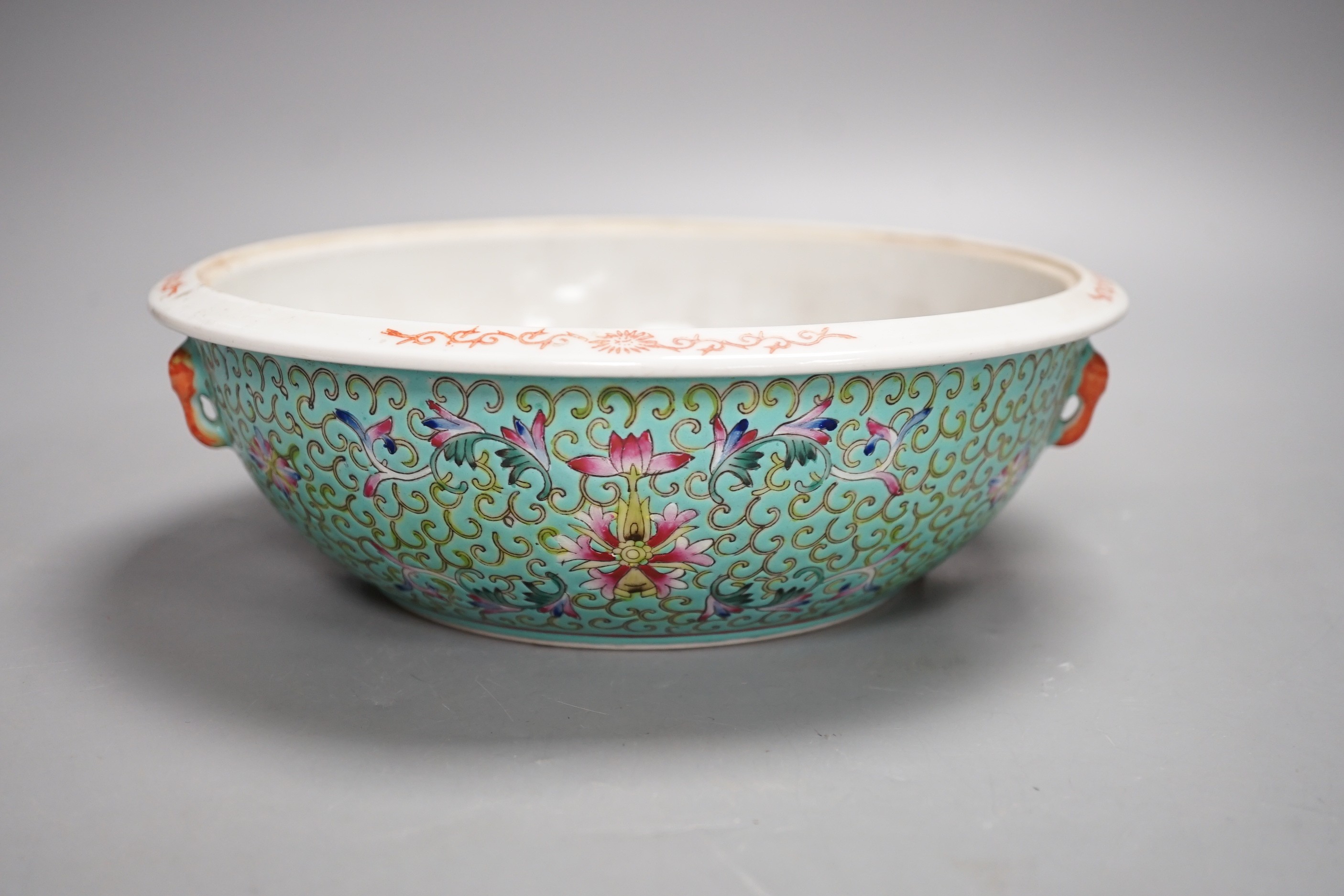 A 20th century Chinese famille rose turquoise ground floral bowl. 23.5cm diameter, lacking cover